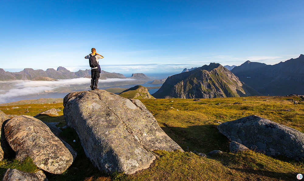 Tourist taking picture at Ryten, Moskenesøya, Lofoten, Norway