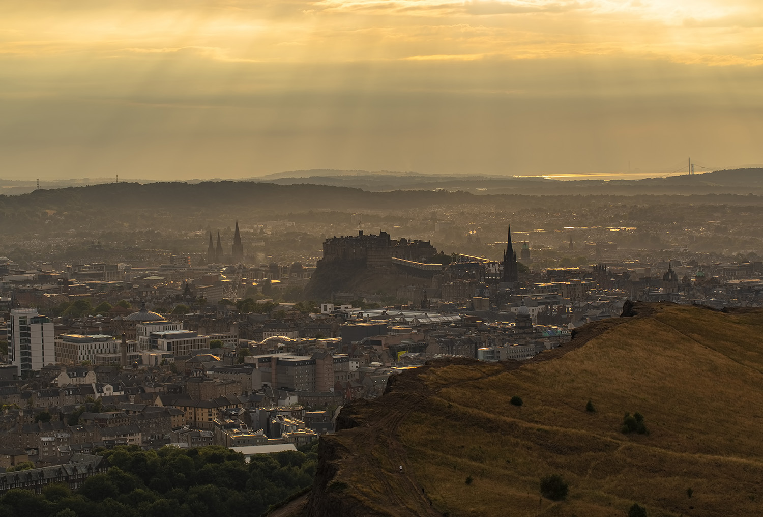 Rays of sunshine over Edinburgh from Arthur's Seat